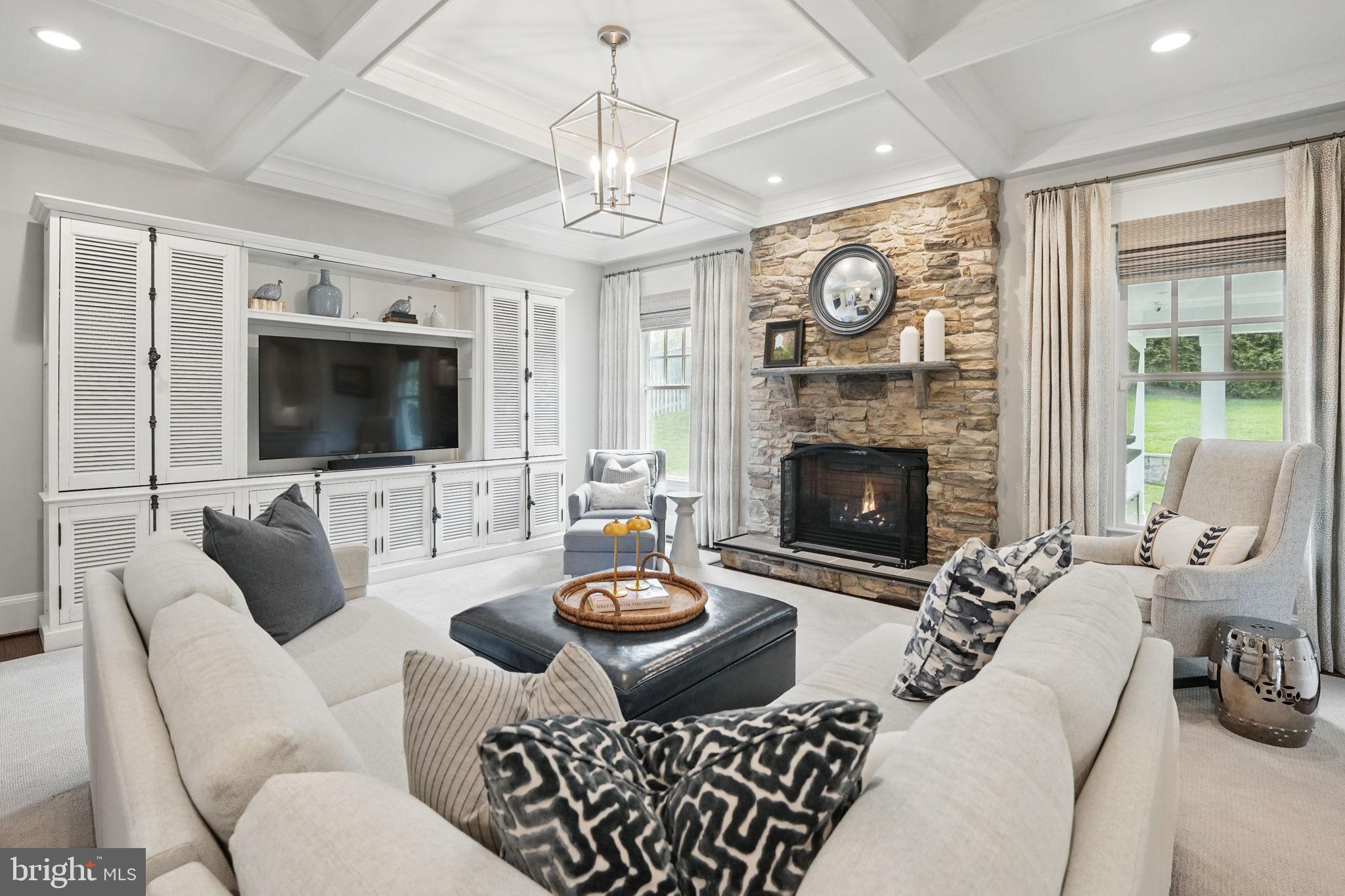 6645 Byrns Place McLean, VA 22101 - Photo 16 of 64 a living room with furniture a fireplace and a flat screen tv
