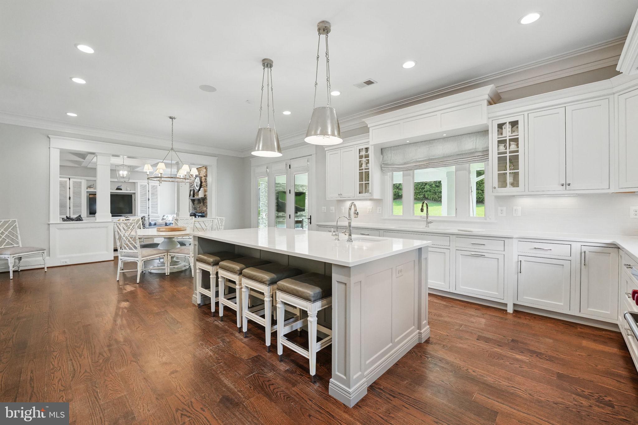 6645 Byrns Place McLean, VA 22101 - Photo 22 of 64 a kitchen with stainless steel appliances granite countertop a lot of counter space and wooden floors