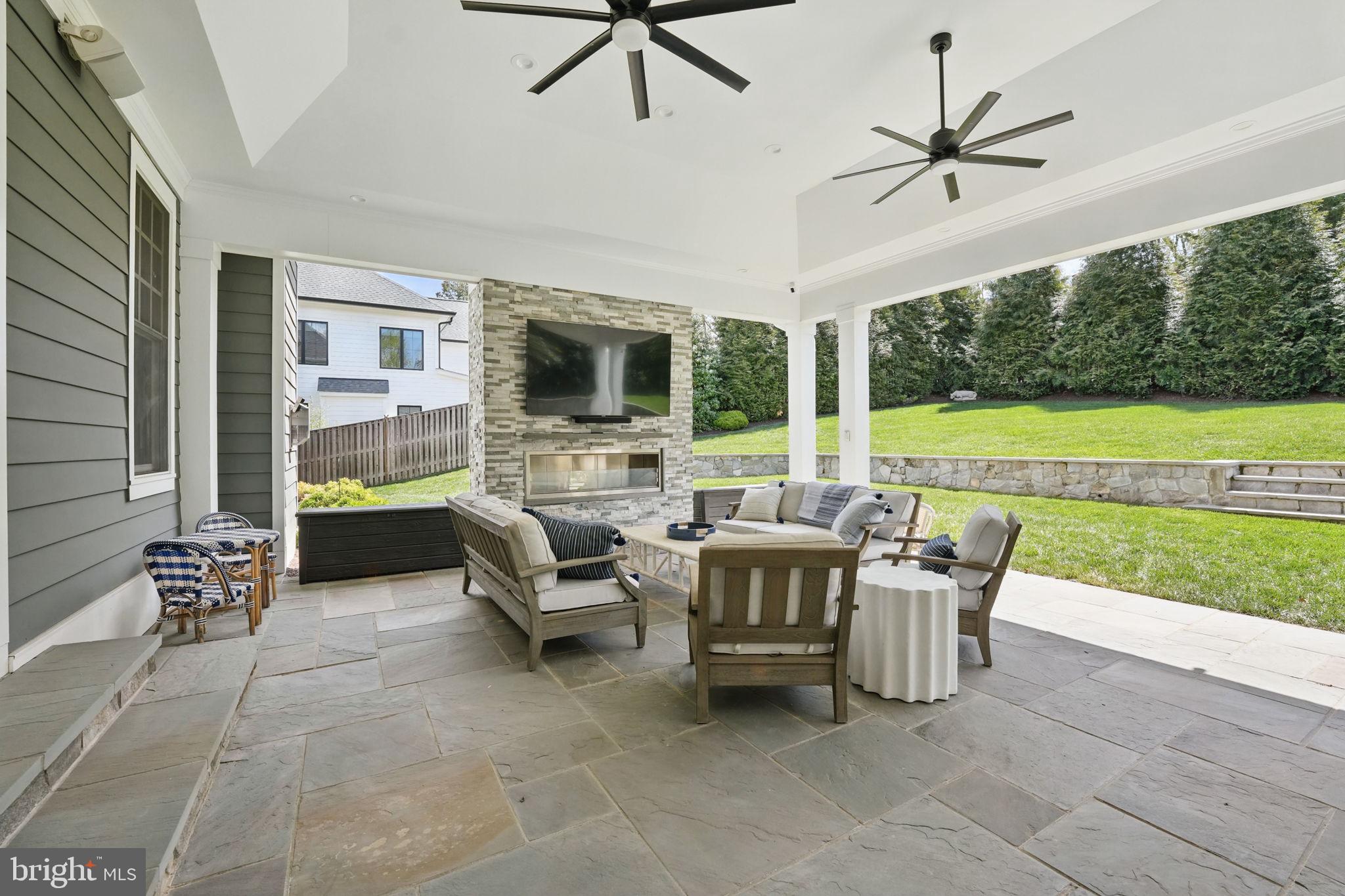 6645 Byrns Place McLean, VA 22101 - Photo 23 of 64 a living room with furniture and a floor to ceiling window