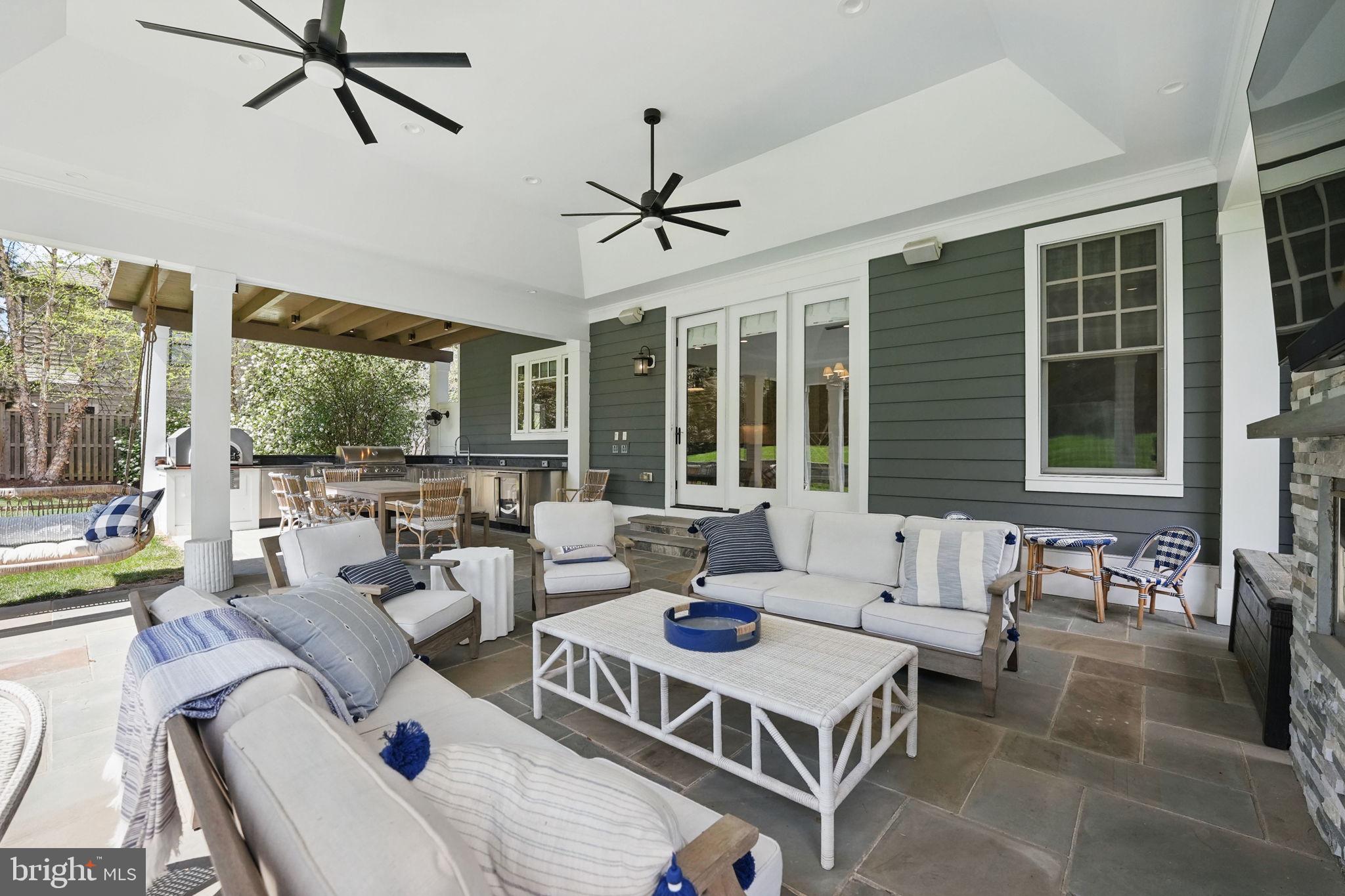 6645 Byrns Place McLean, VA 22101 - Photo 25 of 64 a living room with furniture a large window and a table