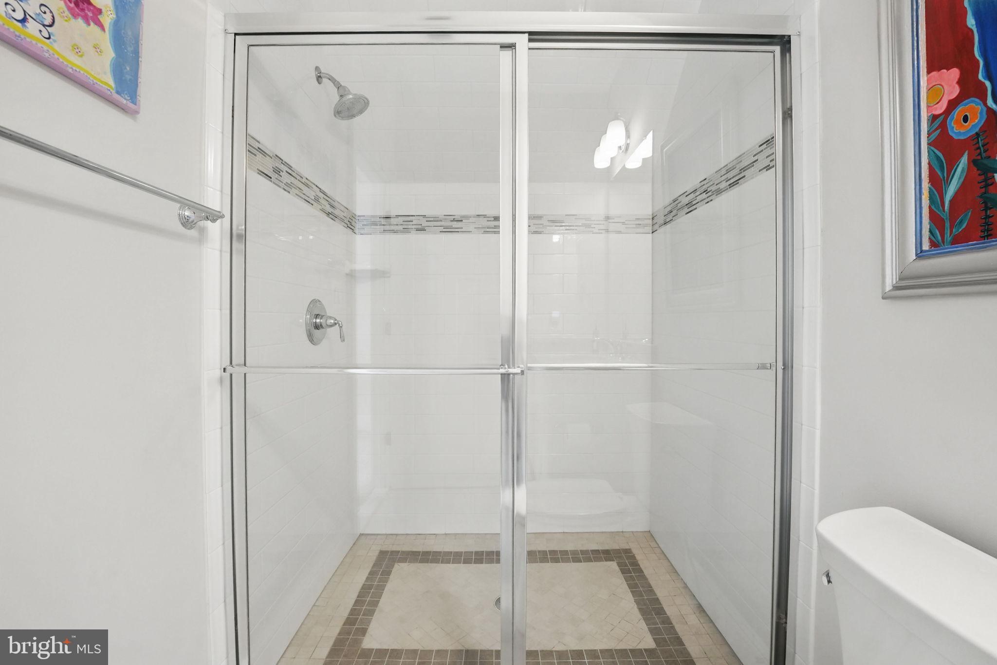 6645 Byrns Place McLean, VA 22101 - Photo 45 of 64 a bathroom with a shower
