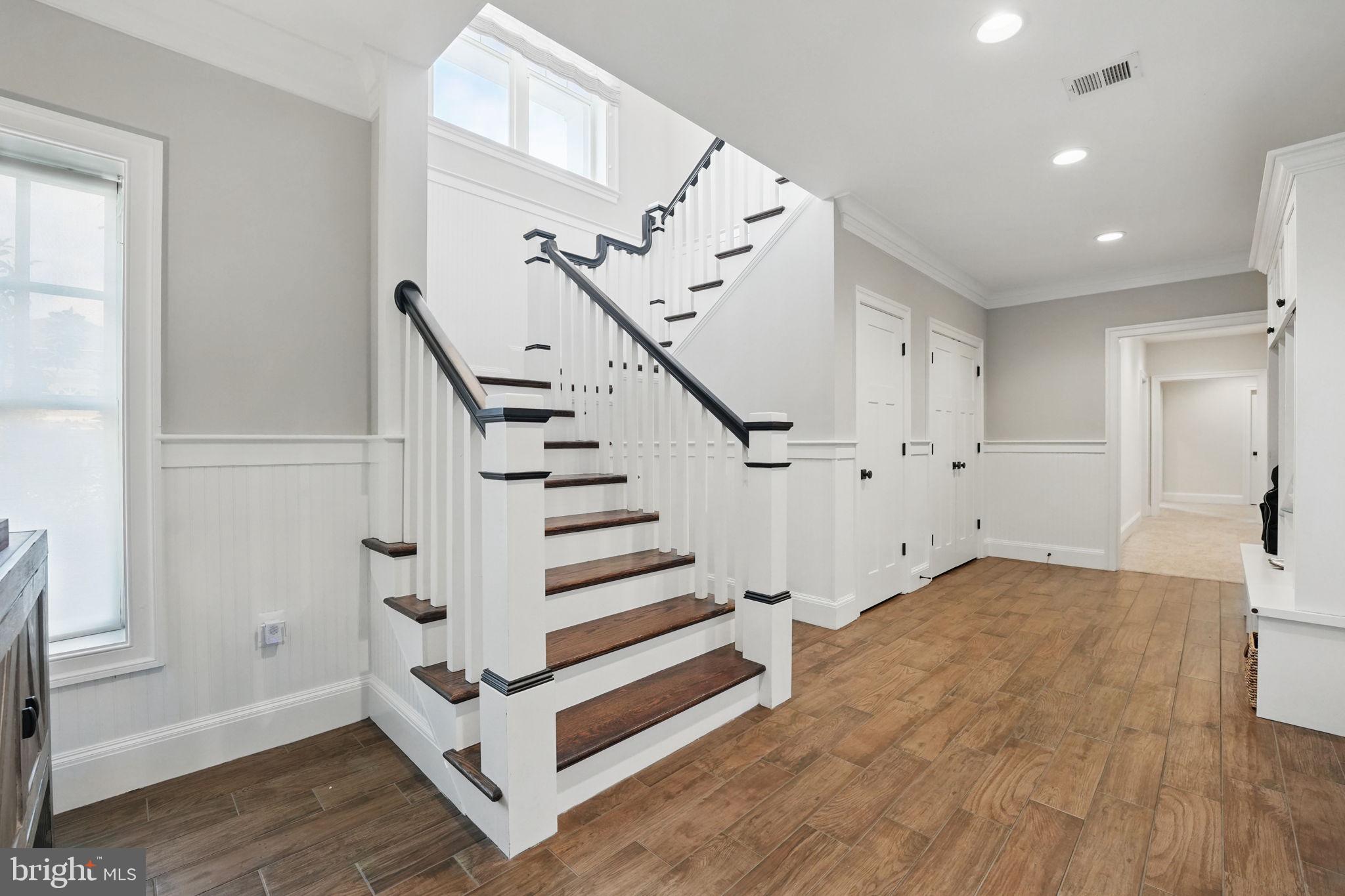 6645 Byrns Place McLean, VA 22101 - Photo 47 of 64 a view of entryway with wooden floor and stairs