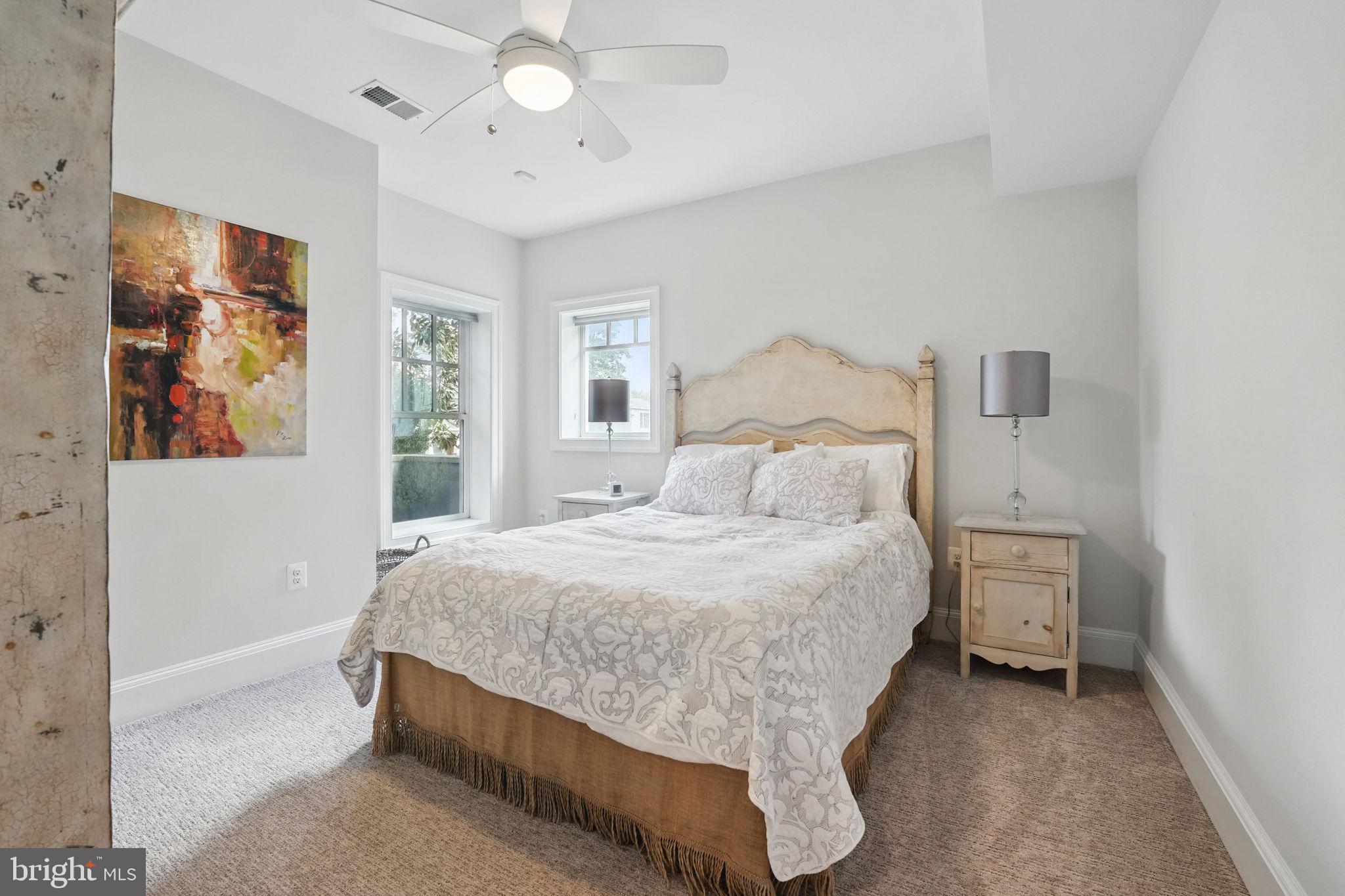 6645 Byrns Place McLean, VA 22101 - Photo 56 of 64 a bedroom with a bed and a painting on the wall
