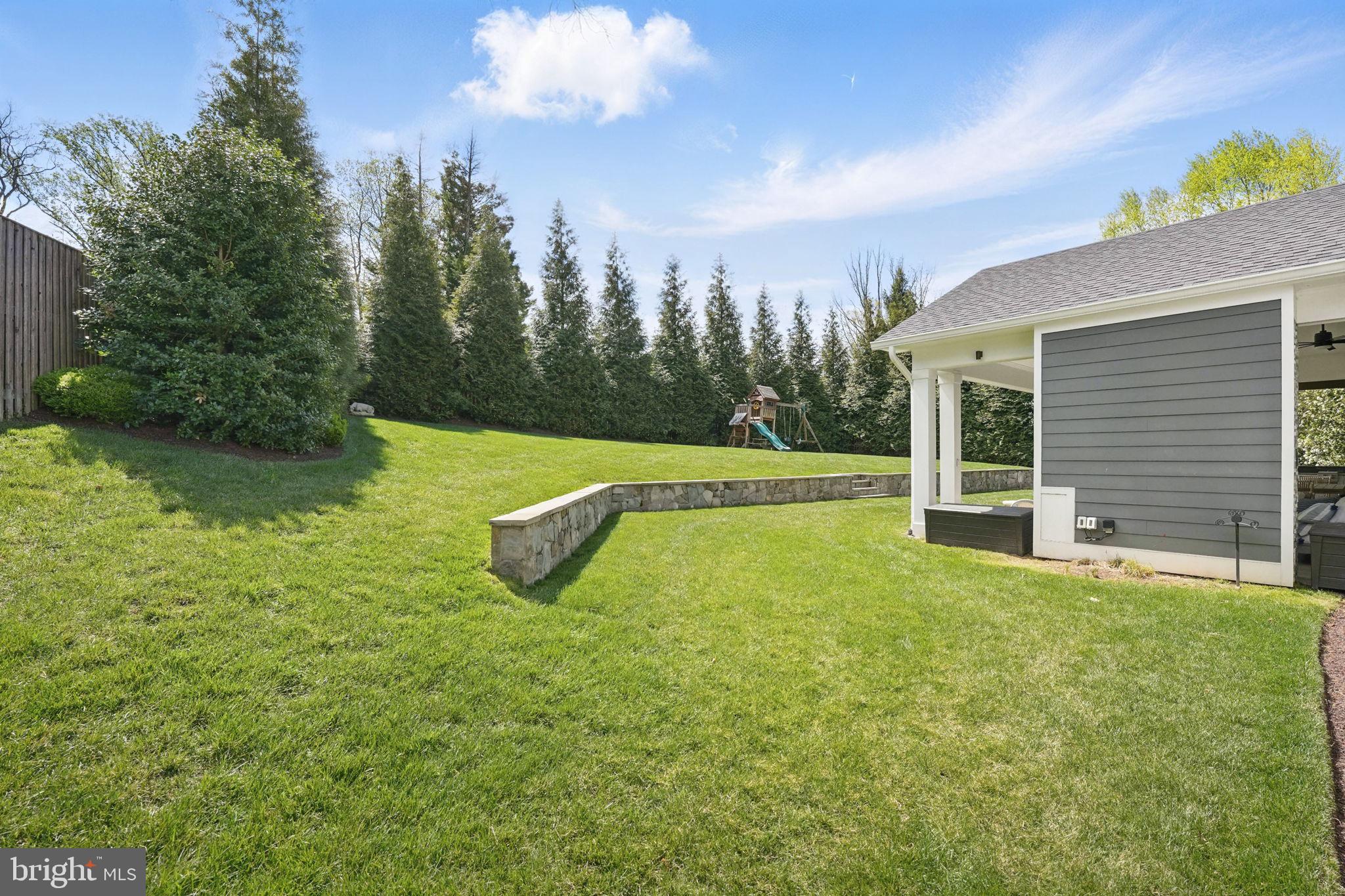 6645 Byrns Place McLean, VA 22101 - Photo 61 of 64 a view of a yard with a house