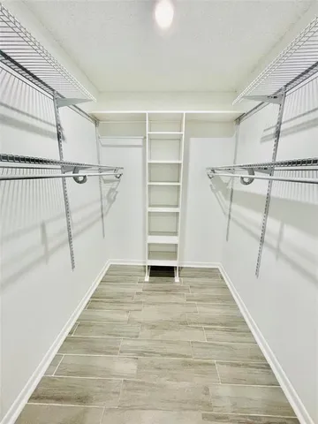 a view of an empty walk in closet