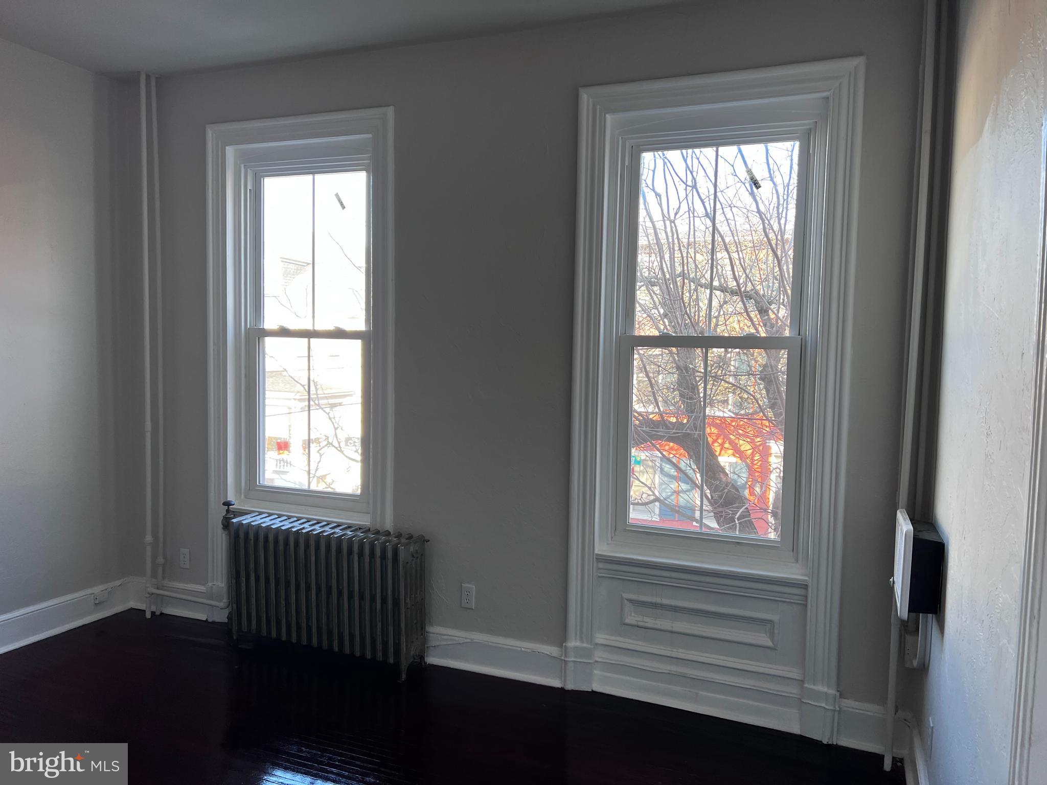 104 King Street, Unit 2F Pottstown, PA 19464 - Photo 6 of 7 an empty room with wooden floor and windows