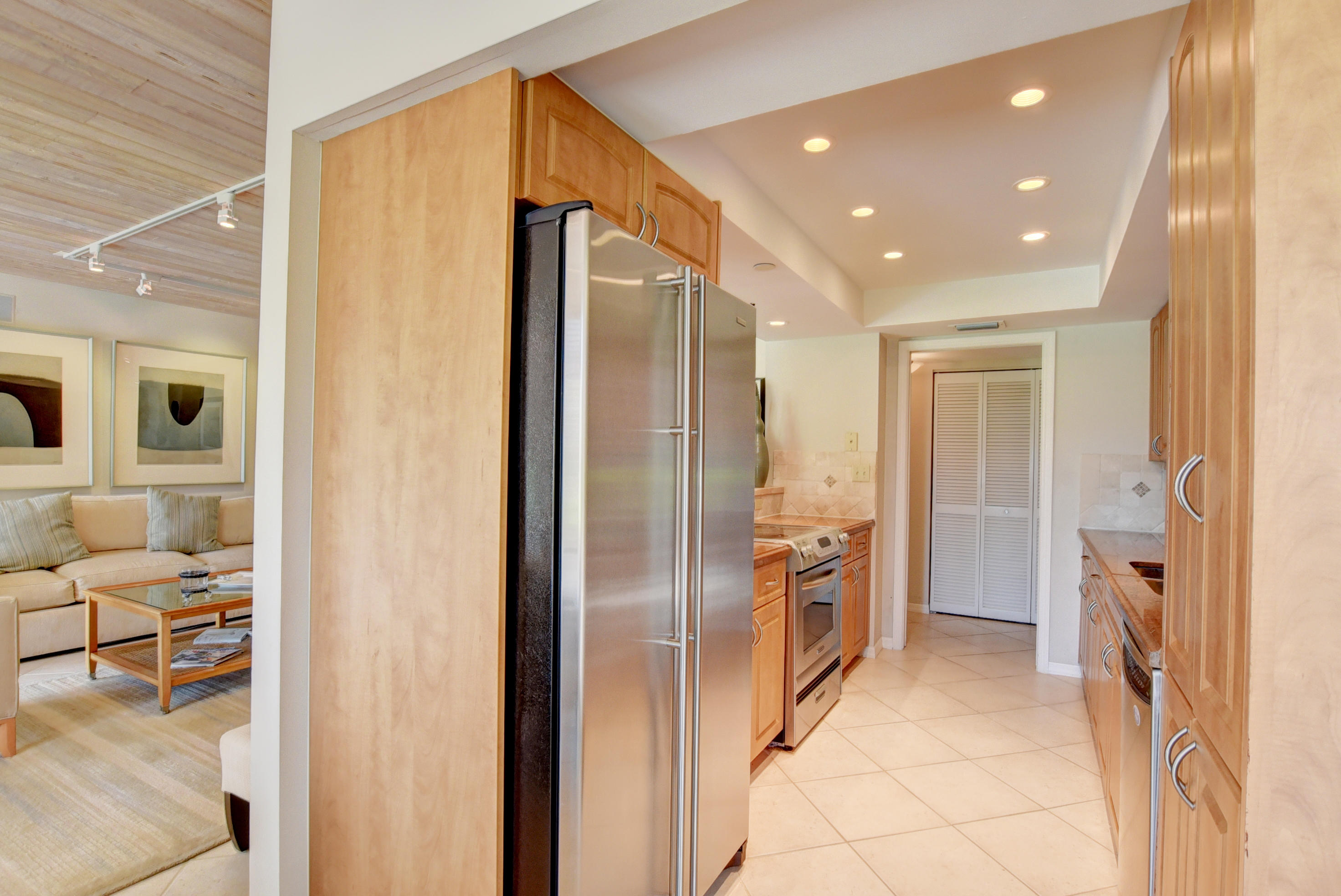 140 Southeast 5th Avenue, Unit 239 Boca Raton, FL 33432 - Photo 19 of 68 Enclosed Wood Casing around Regrigerator