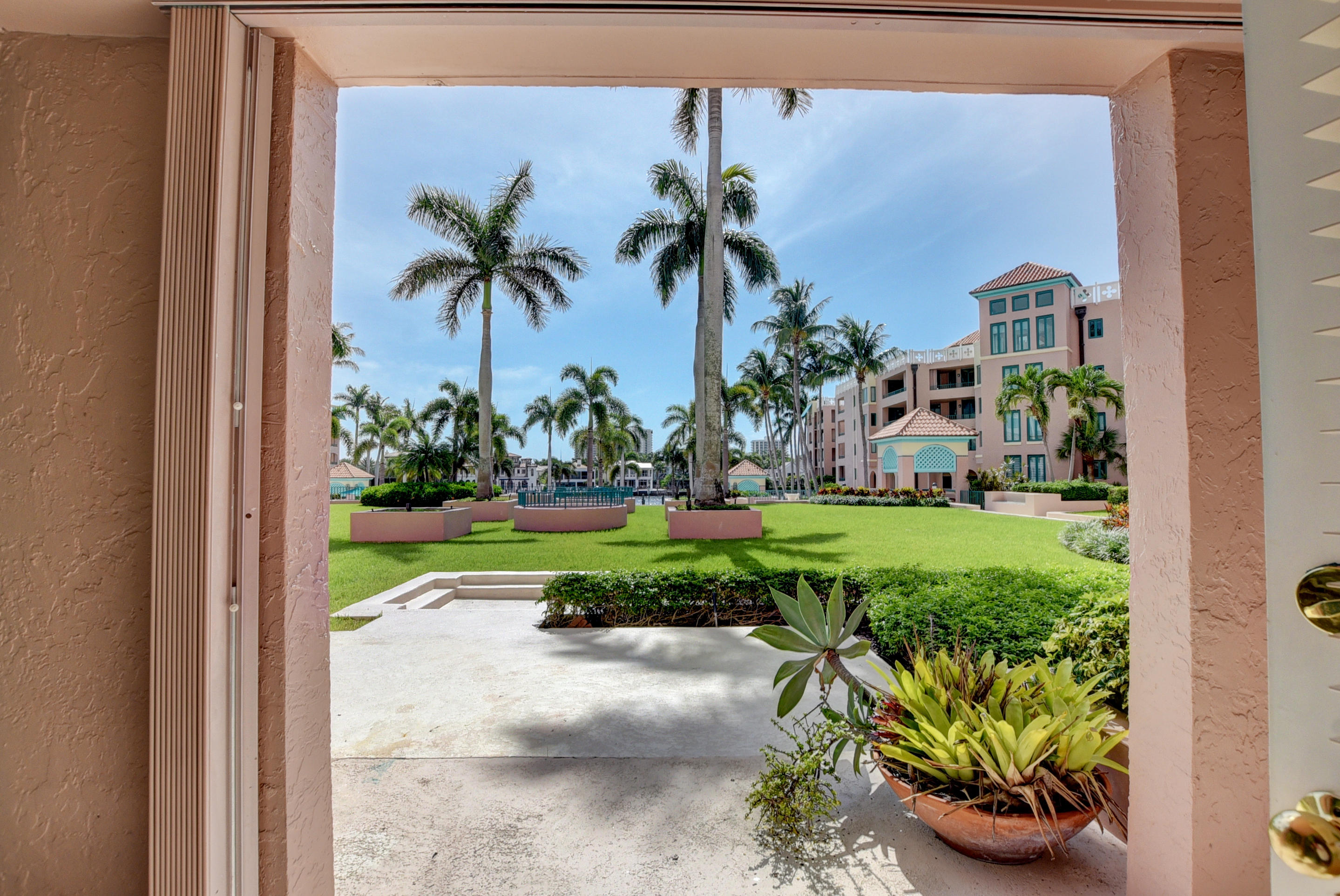 140 Southeast 5th Avenue, Unit 239 Boca Raton, FL 33432 - Photo 32 of 68 Larger Patio Leads to Pool Area