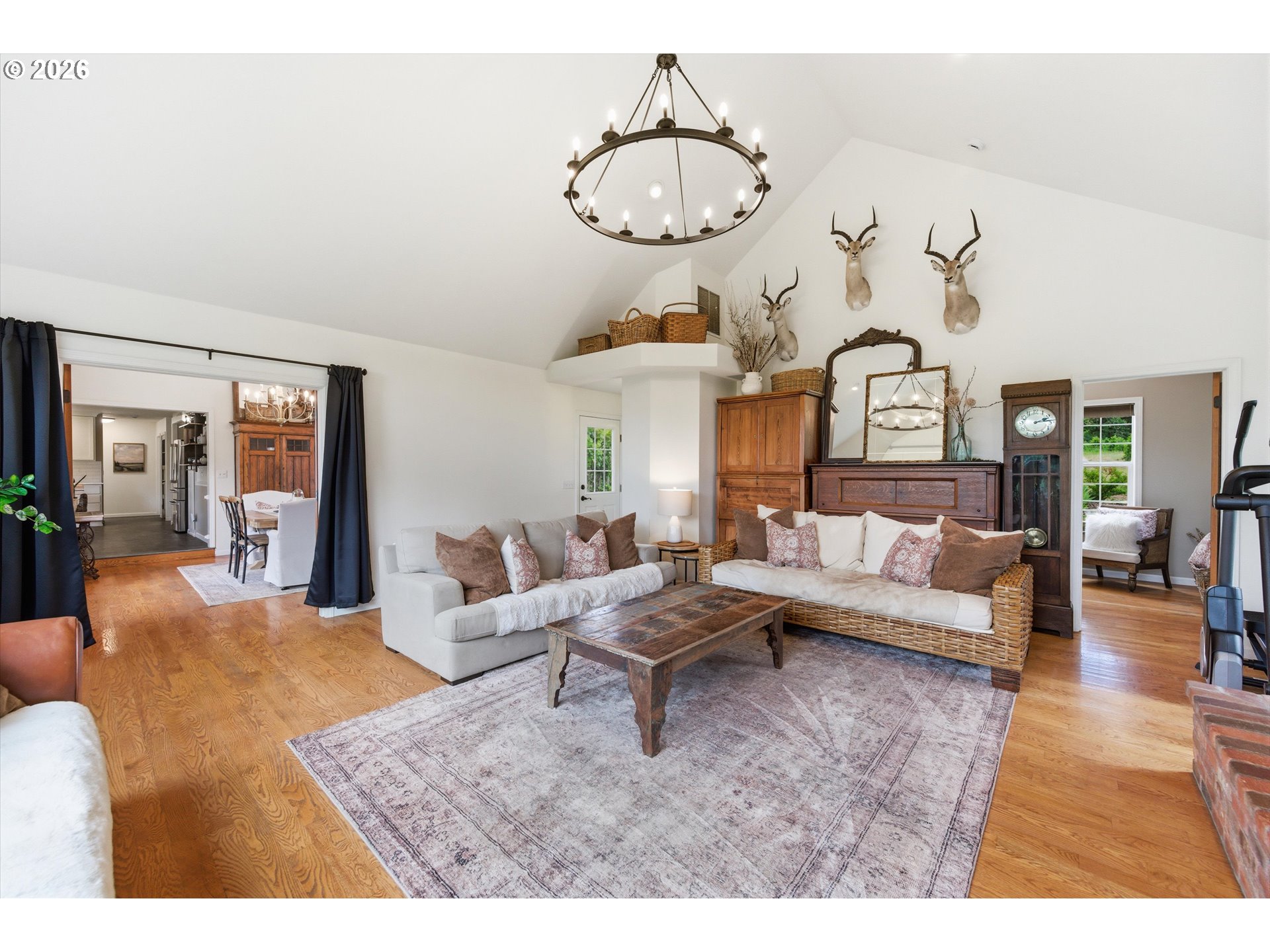 13880 McCaleb Road Monmouth, OR 97361 - Photo 23 of 44 a living room with furniture chandelier and a mirror