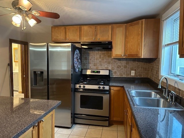 34 Perkins Street, Unit 1 Gloucester, MA 01930 - Photo 1 of 14 a kitchen with a stove a sink and a refrigerator