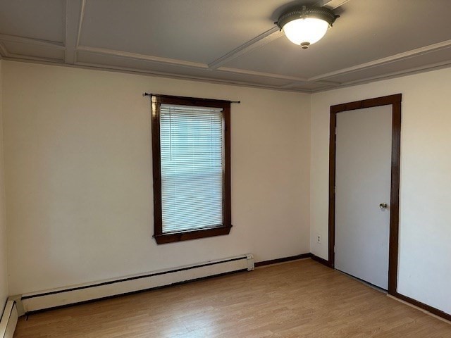 34 Perkins Street, Unit 1 Gloucester, MA 01930 - Photo 4 of 14 an empty room with wooden floor and windows