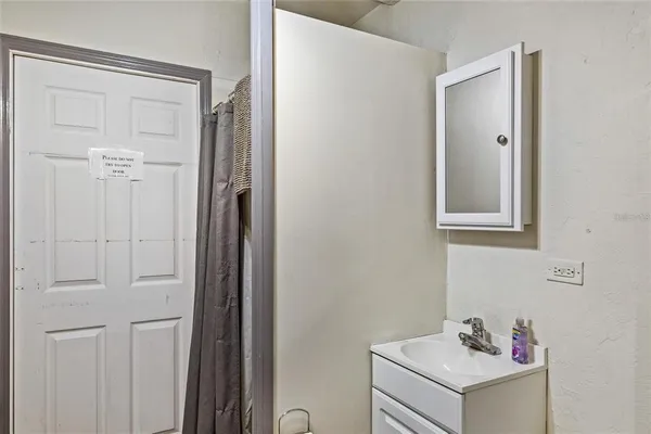 a bathroom with a sink and vanity