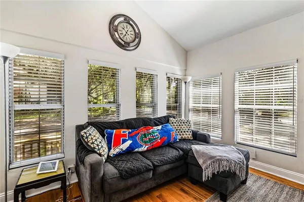 a living room with furniture and a large window