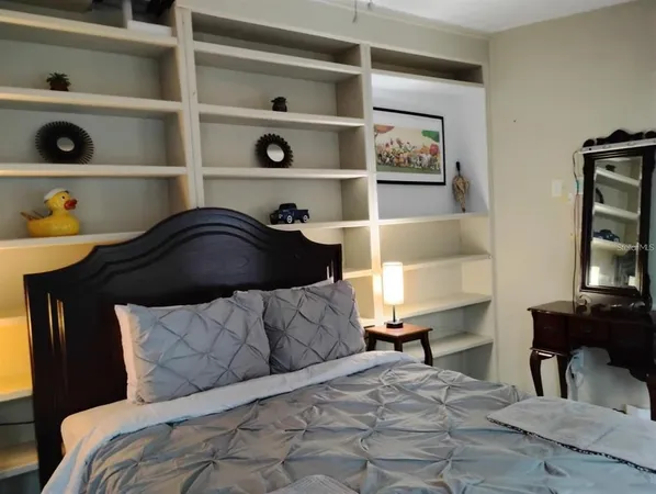a bedroom with a bed and closet