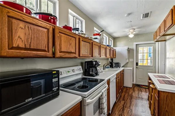 a kitchen with stainless steel appliances granite countertop a stove and a sink