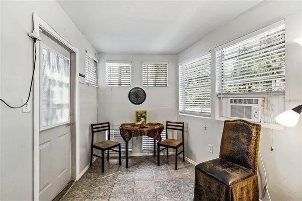 a view of a livingroom with furniture and windows