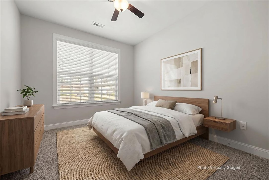 21 Barron Glenn Way Anderson, SC 29621 - Photo 37 of 48 This spacious secondary Bedroom features a neutral color palette, creating a serene and adaptable living space.
