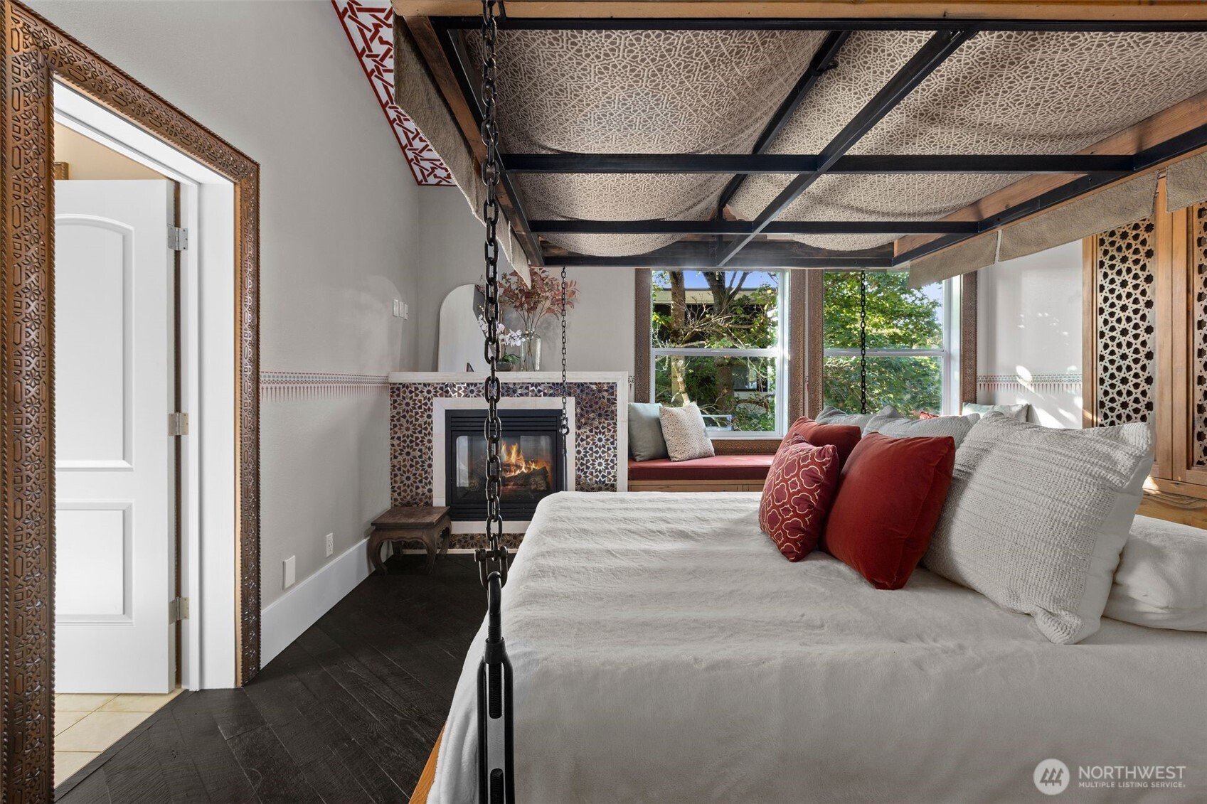 1147 Federal Avenue East Seattle, WA 98102 - Photo 19 of 40 a large bed sitting in a bedroom next to a window