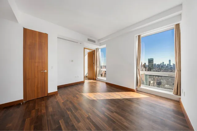 a bathroom with a granite countertop sink a mirror and a