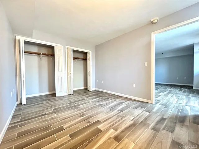 a view of a livingroom with wooden floor and closet