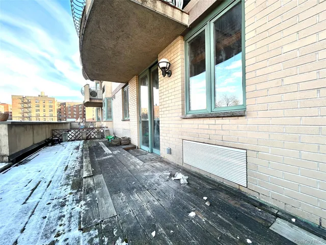 a view of a backyard with sitting area