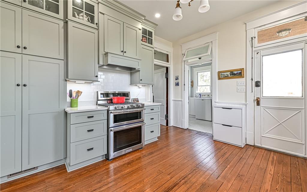 342 Airport Road Butler, PA 16002 - Photo 12 of 32 a kitchen with stainless steel appliances granite countertop a stove and a refrigerator