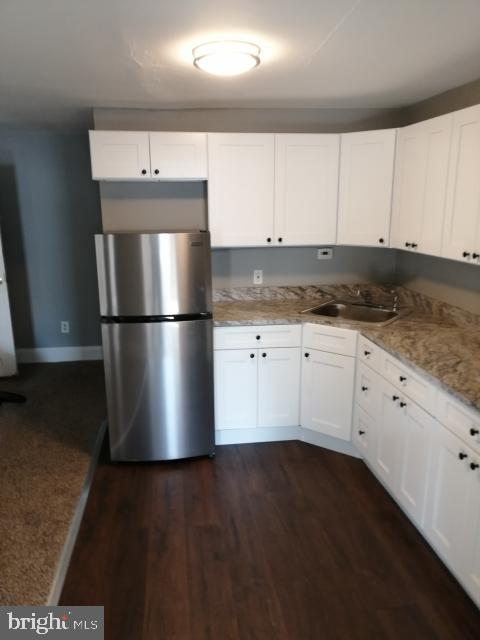 4329 Main Street, Unit 2 Philadelphia, PA 19127 - Photo 2 of 5 a view of kitchen with granite countertop stainless steel appliances counter space and wooden floor