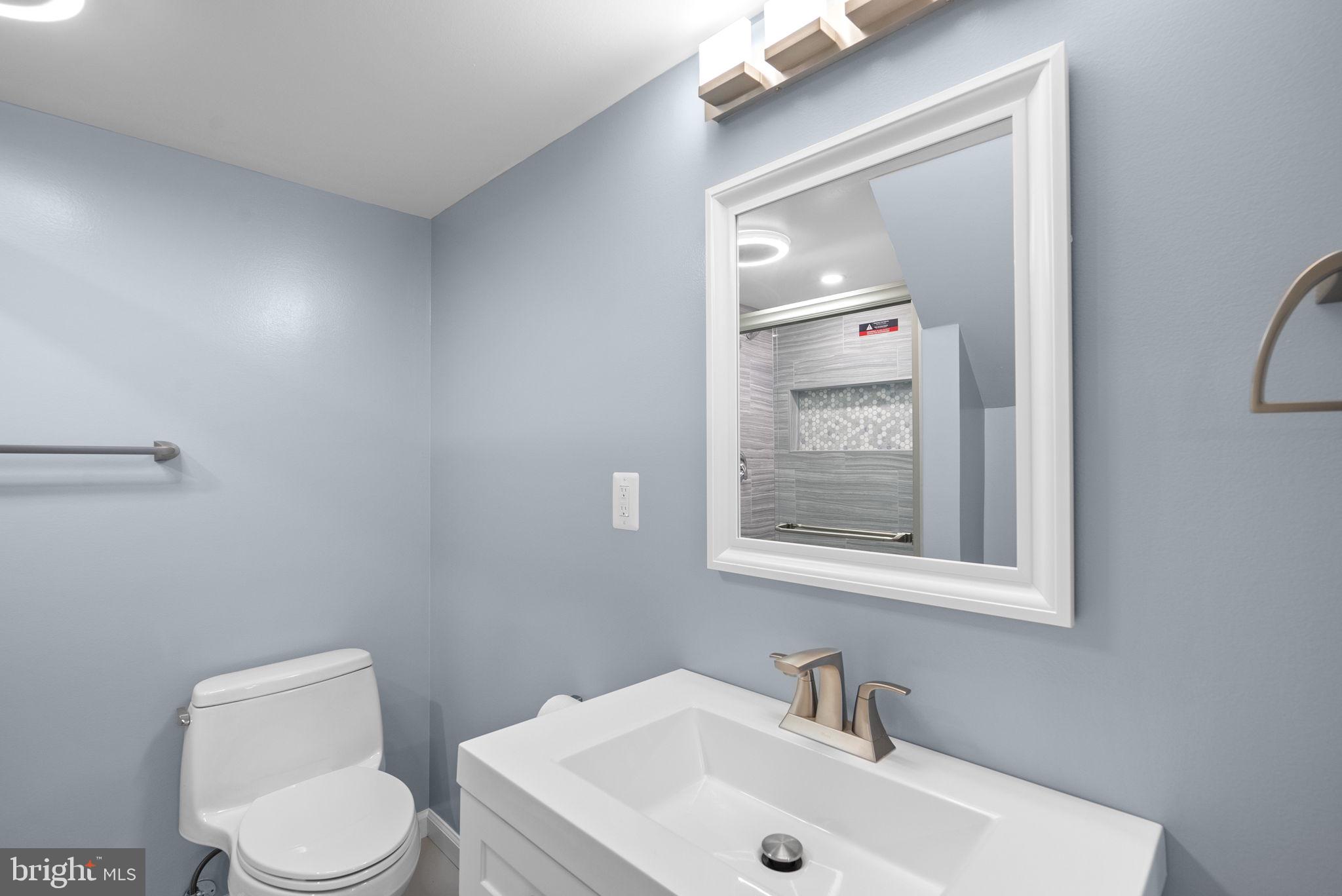 3013 Medway Street Silver Spring, MD 20902 - Photo 24 of 30 Sleek bathroom with modern accents.