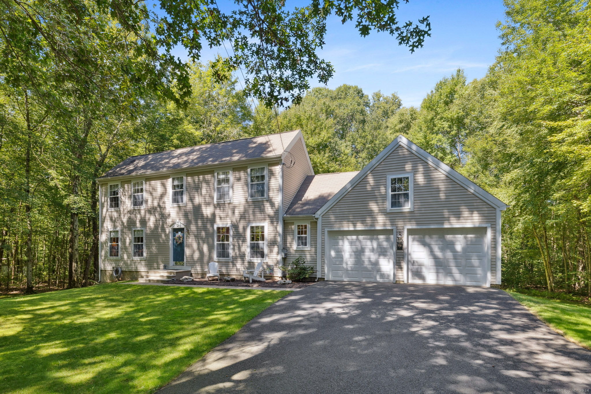 7 East Porter Road Ellington, CT 06029 - Photo 1 of 1 a front view of a house with a garden