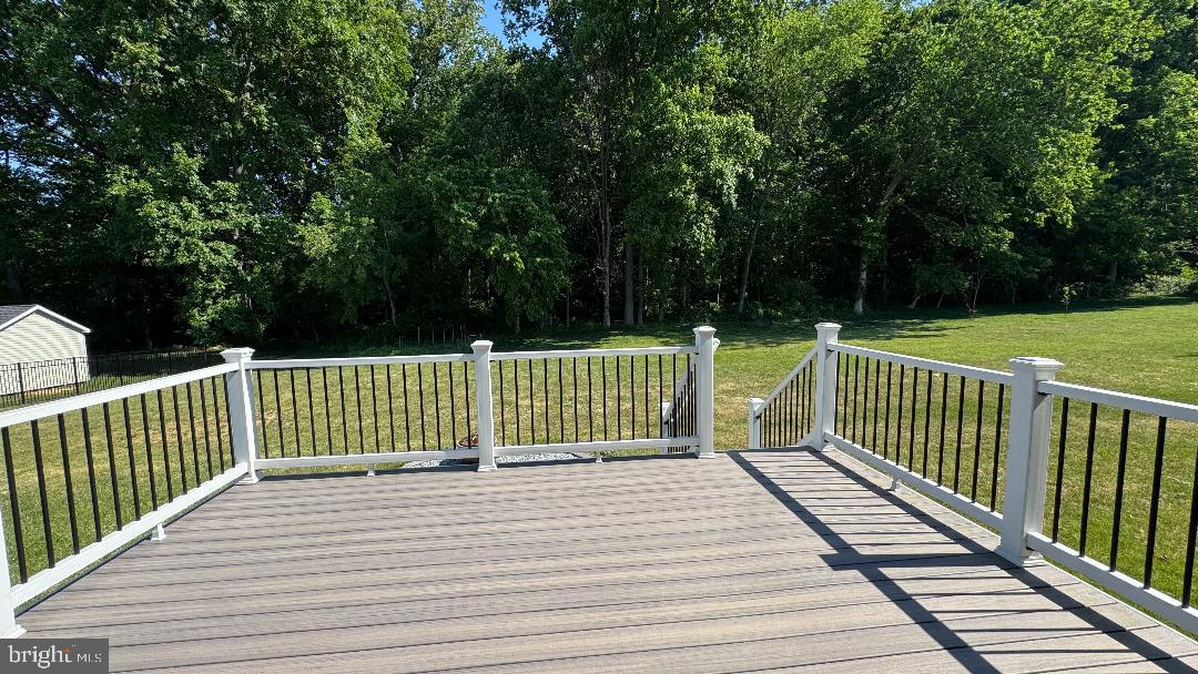 1236 Pimpernell Path Middletown, DE 19709 - Photo 36 of 37 a view of deck with white wooden fence and trees