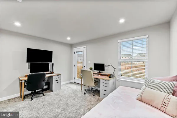 a workspace with furniture and a window