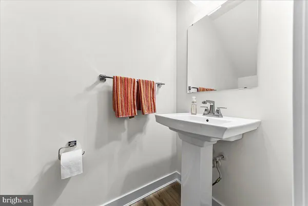 a bathroom with a sink and mirror