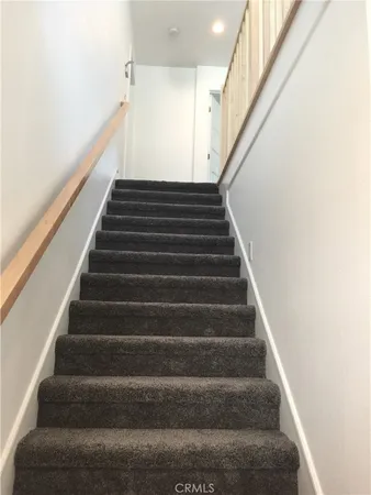 a view of a balcony with wooden floor
