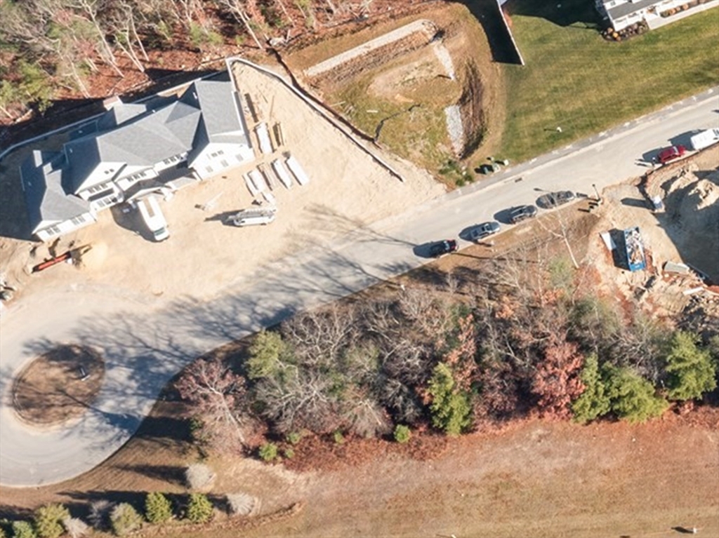16 Couture Way Middleton, MA 01949 - Photo 2 of 2 a view of a yard with wooden fence