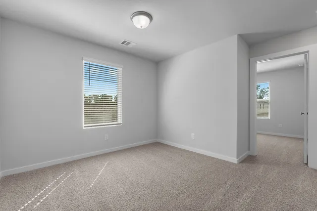 an empty room with windows