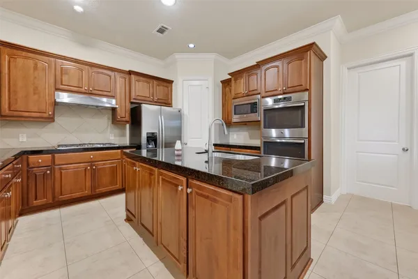 a view of a house with yard and a garden