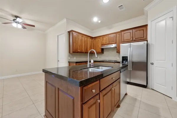 an empty room with fan and ceiling fan