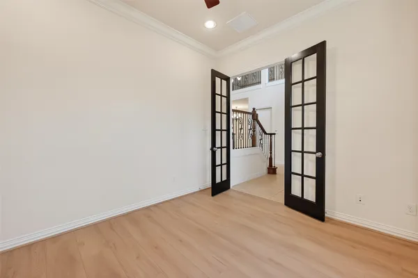 a view of a chandelier fan and entryway