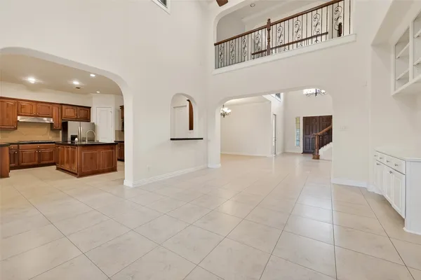 a kitchen with stainless steel appliances granite countertop a stove refrigerator and cabinets