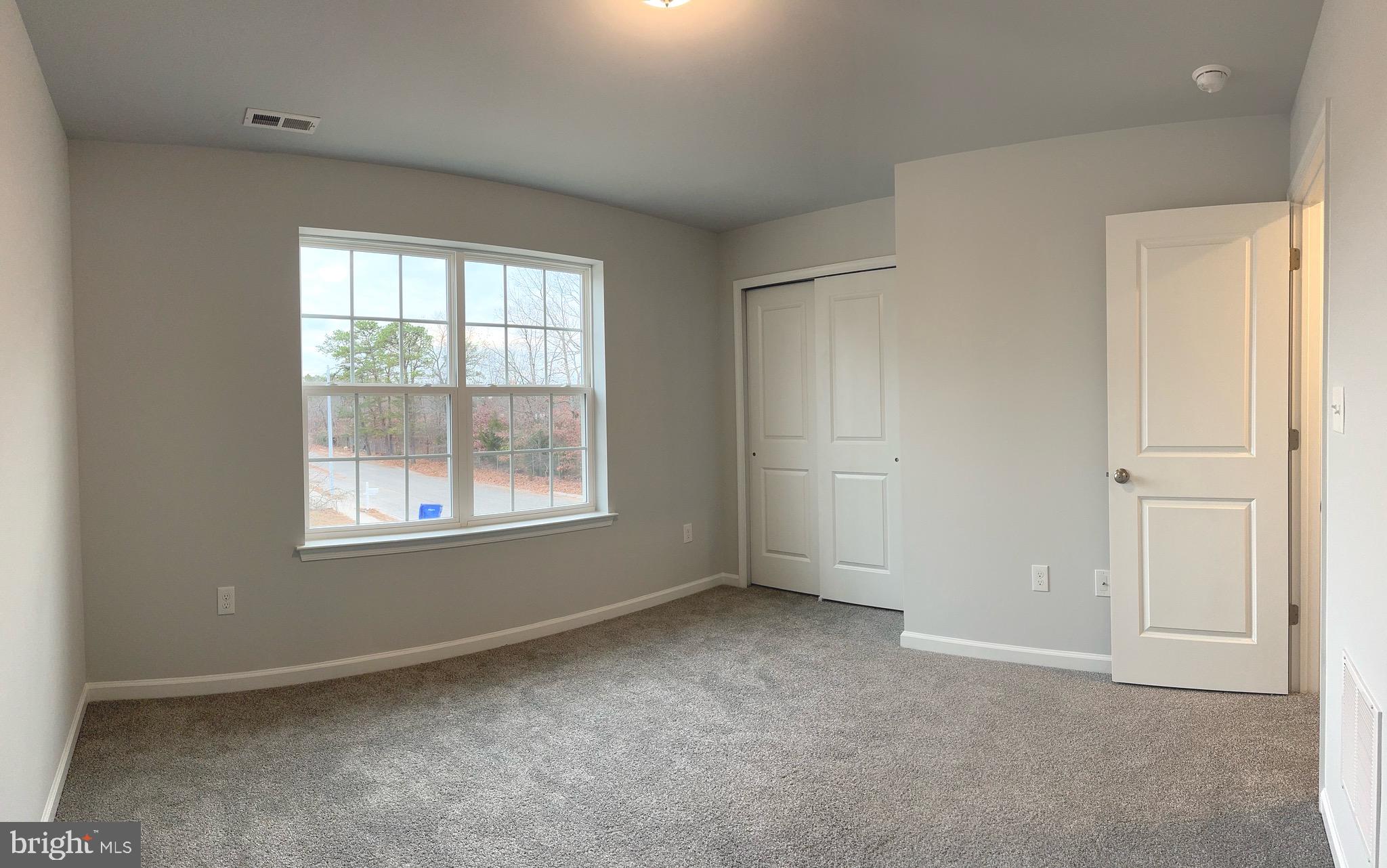 113 Henry Street Bridgeton, NJ 08302 - Photo 16 of 24 a view of an empty room with a window