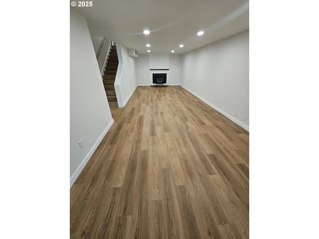 a view of a hallway with stairs