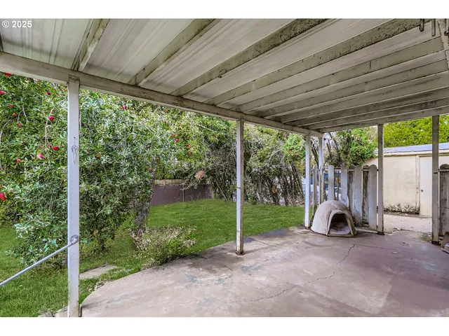 a view of a yard with a house in the background