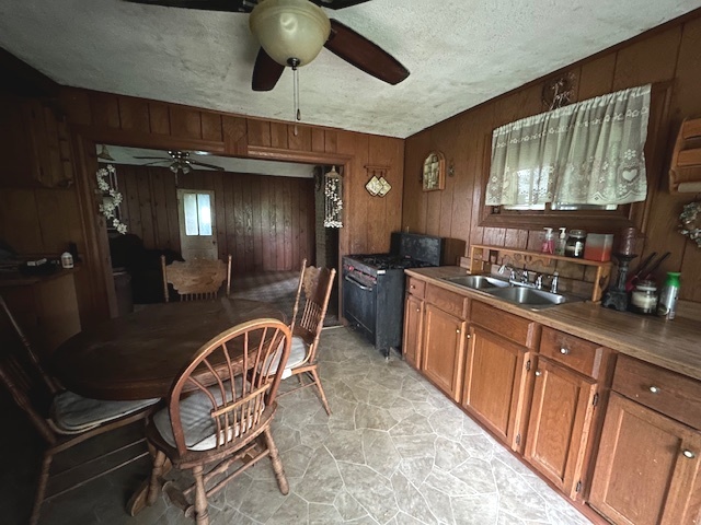 20881 West Angle Road Wilmington, IL 60481 - Photo 5 of 15 a kitchen with stainless steel appliances granite countertop a sink and a refrigerator