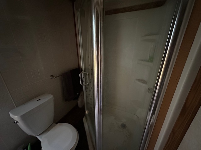 20881 West Angle Road Wilmington, IL 60481 - Photo 10 of 15 a bathroom with a toilet and a shower
