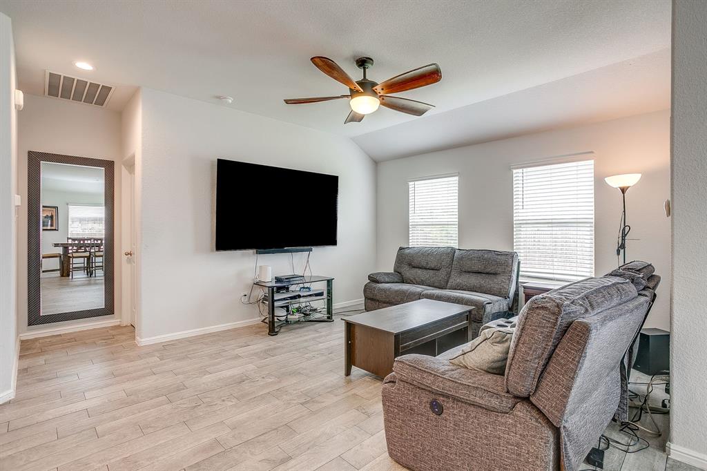 2313 Stallings Road Fort Worth, TX 76108 - Photo 4 of 30 a living room with furniture and a flat screen tv