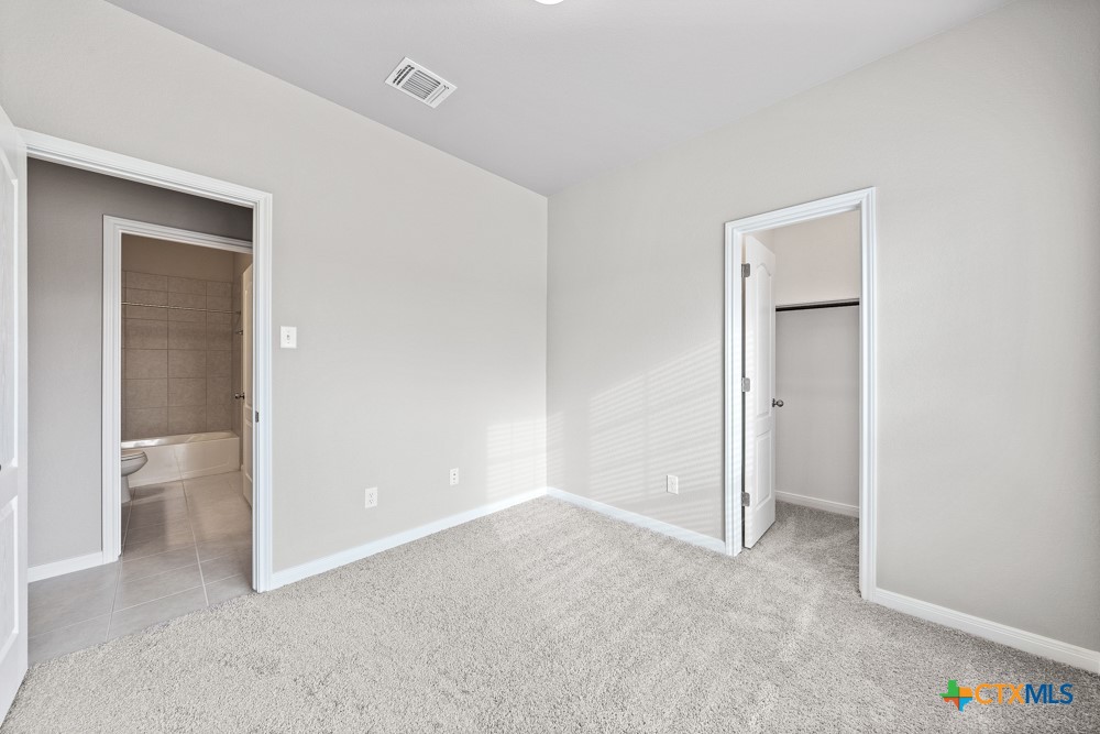 1028 Coriander Road Temple, TX 76501 - Photo 12 of 23 a view of an empty room and a bathroom