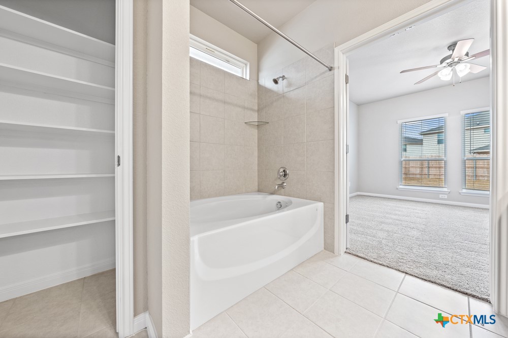 1028 Coriander Road Temple, TX 76501 - Photo 15 of 23 a spacious bathroom with a bathtub and a shower