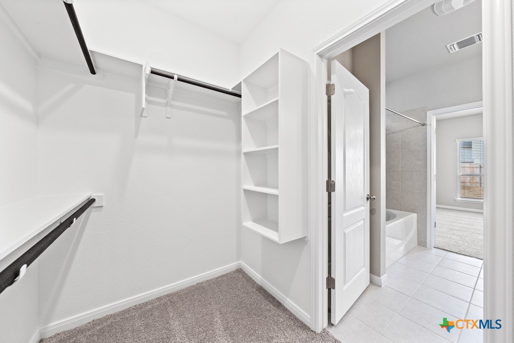 1028 Coriander Road Temple, TX 76501 - Photo 18 of 23 a view of an empty walk in closet