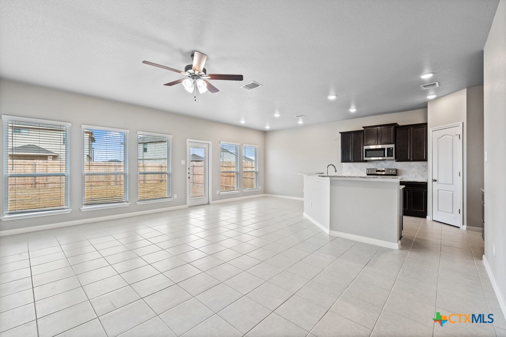 1028 Coriander Road Temple, TX 76501 - Photo 7 of 23 a view of an empty room with window and cabinet