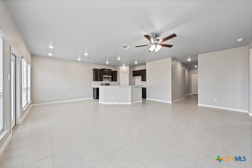 1028 Coriander Road Temple, TX 76501 - Photo 8 of 23 a view of a kitchen with a sink and a refrigerator